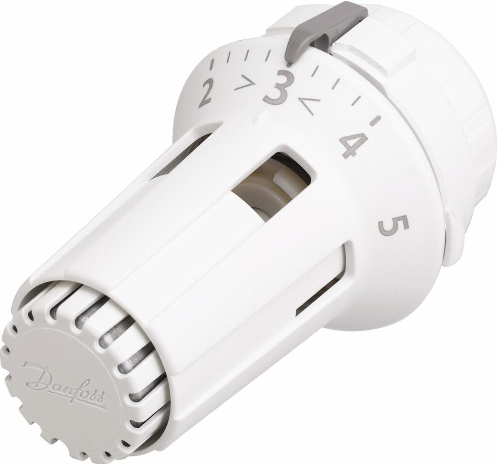 systemes-chauffage-robinet Un thermostat blanc avec un bouton blanc, essentiel pour le contrôle des systèmes de chauffage dans un intérieur moderne.